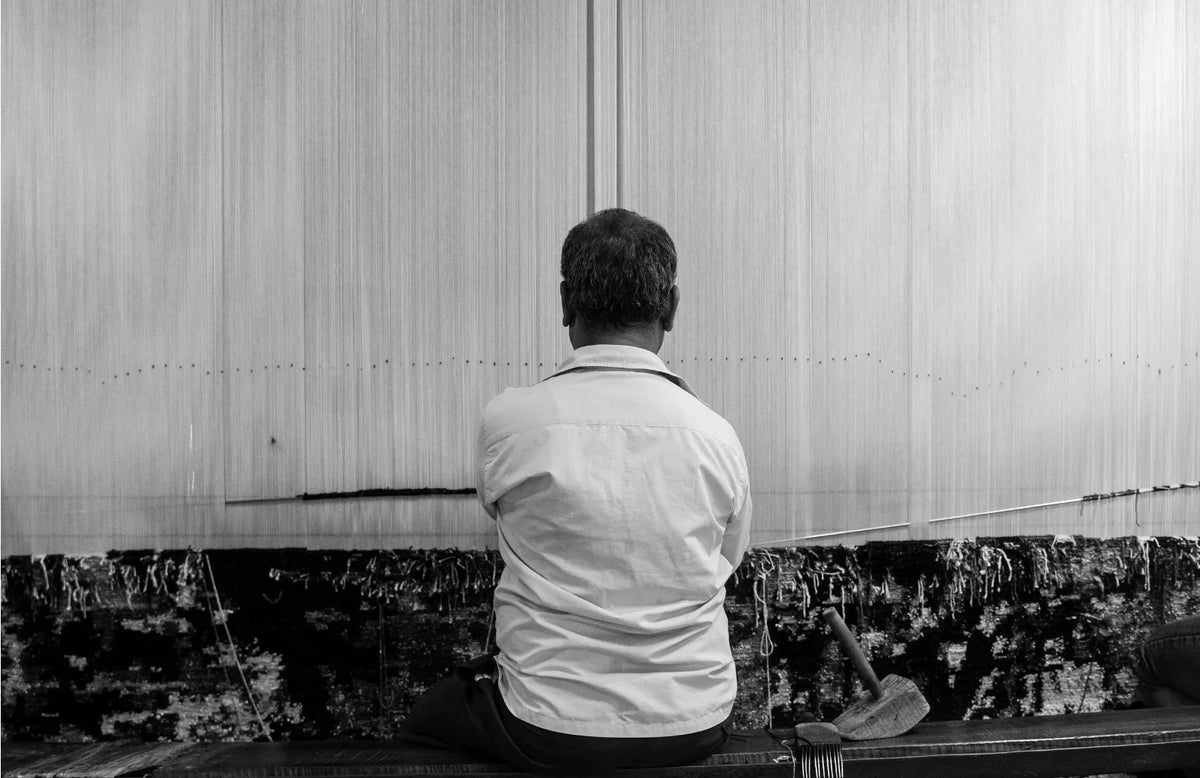 Carpets in Delhi handcrafted by skilled artisans weaving a premium handmade rug using traditional techniques