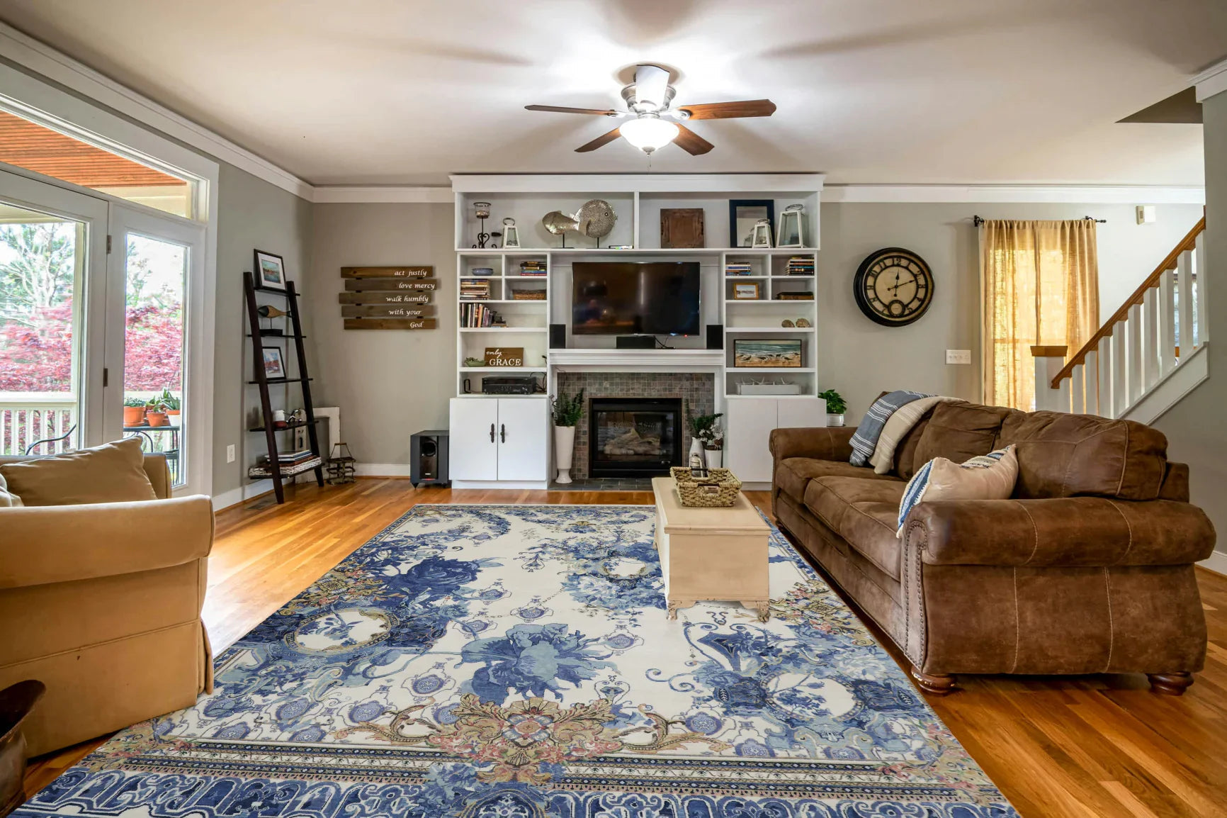 Carpets in Delhi featuring a luxury blue floral area rug in a spacious modern living room with elegant home decor