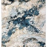 Abstract rug design featuring swirling blue, beige, and white patterns resembling a watercolor landscape. The tone is artistic and serene.