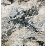 Abstract rug design with a marbled texture in shades of gray, beige, and cream. It has a dynamic, organic pattern, evoking a sense of movement.