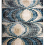 Abstract geometric rug pattern features overlapping ovals in shades of blue, beige, and gray. The design creates a sense of depth and symmetry.