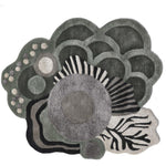 Abstract floral luxury rug with layered geometric patterns in gray, black, and cream tones