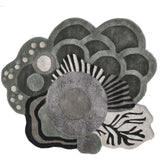 Abstract floral luxury rug with layered geometric patterns in gray, black, and cream tones