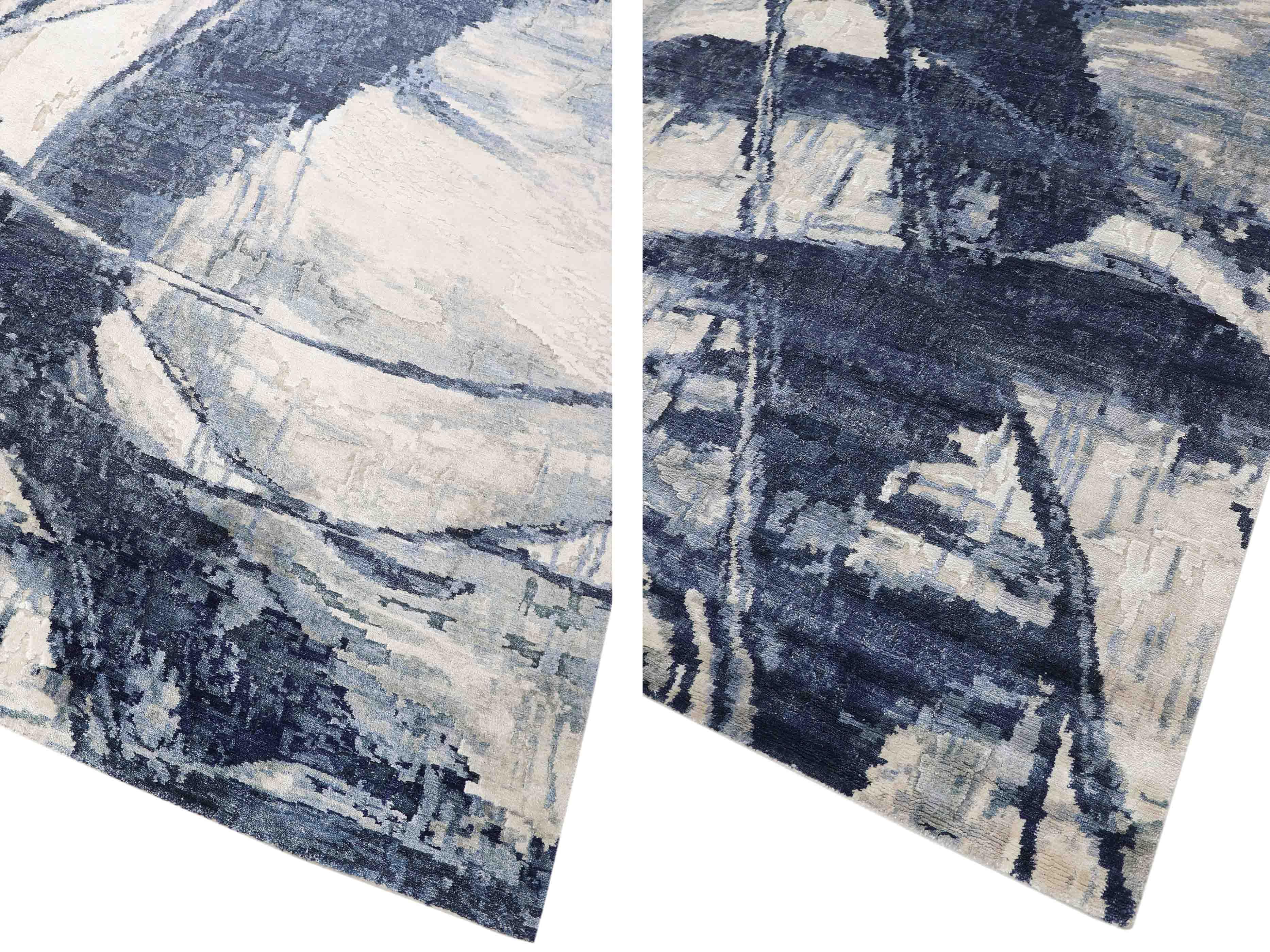 Abstract blue and cream luxury rug with textured brushstroke pattern, ideal for modern home decor
