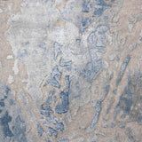 Luxury handcrafted rug with abstract blue and beige patterns, adding elegance to home decor