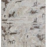 Abstract area rug with a distressed pattern featuring beige, gray, and brown tones. The design resembles a weathered, textured landscape.