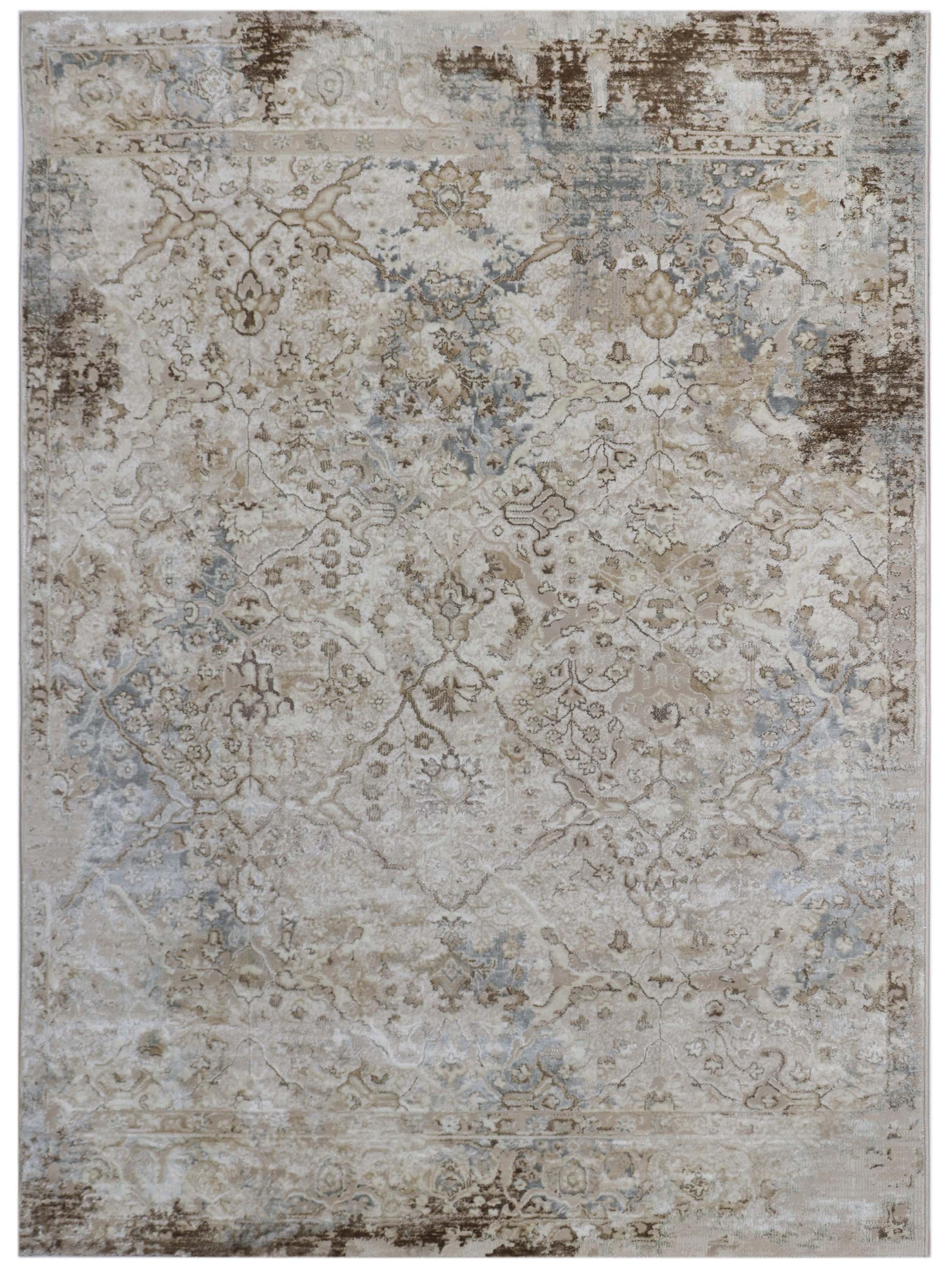 A vintage-style area rug with intricate floral patterns in muted earth tones, featuring subtle blue and brown accents, conveying a rustic, elegant feel.