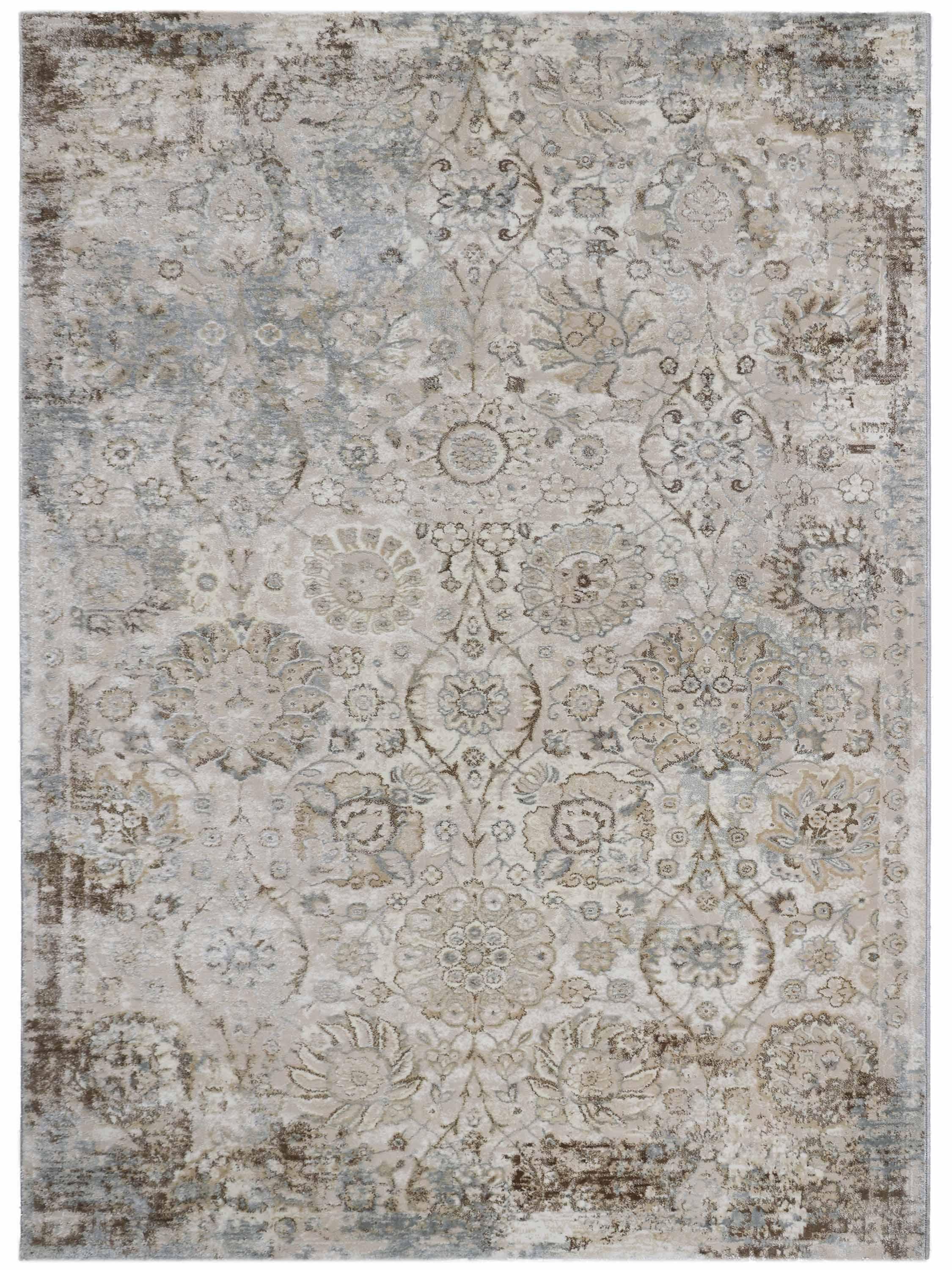 A vintage-style rug with a faded floral and geometric pattern in muted beige, pink, and taupe tones, creating an antique and elegant appearance.