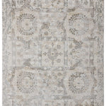 Vintage-style rug with faded intricate patterns of octagons, floral motifs, and abstract shapes in muted beige and gray tones, conveying an antique feel.