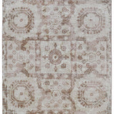 Beige vintage rug with intricate geometric and floral patterns. Faded, distressed look adds a rustic and elegant touch. Symmetrical design.
