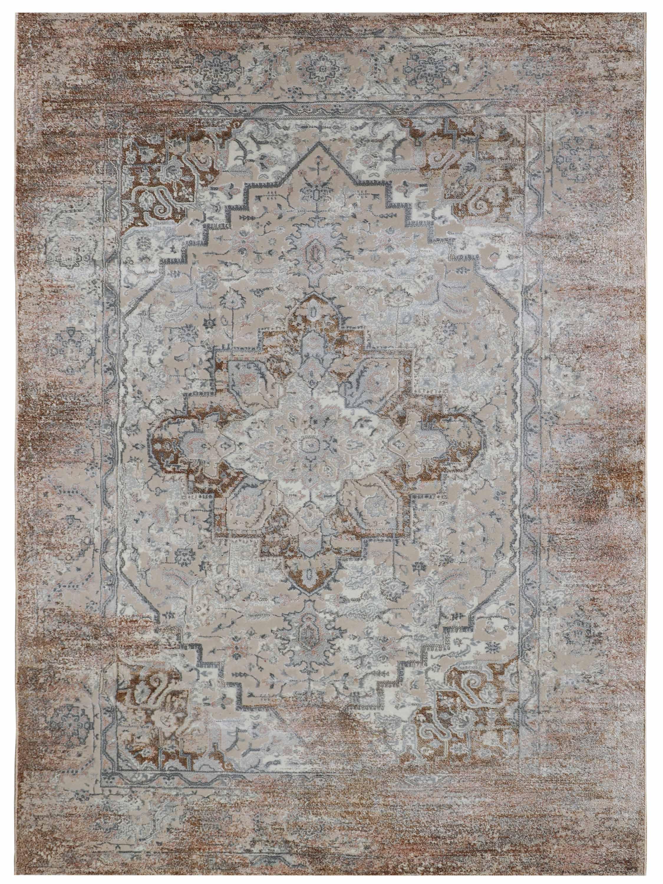 Ornate area rug with intricate floral and geometric patterns in muted beige, blue, and brown tones. It has a vintage, elegant appearance.