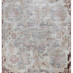 Vintage-style rug with faded floral and geometric patterns in muted tones, mostly beige, and hints of red and blue. Borders are dark and distressed.
