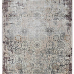 Vintage-style rug featuring a faded floral and geometric pattern in muted tones of beige, gray, and hints of brown, creating an antique, elegant look.