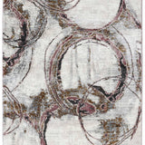 Abstract rug design with swirling circles in gold, pink, and black on a textured off-white background. The patterns create a dynamic, modern feel.