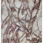 Abstract rug design with chaotic swirling lines in shades of gray, beige, and brown on a light background, conveying a sense of dynamic movement.