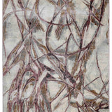 Abstract rug design with chaotic swirling lines in shades of gray, beige, and brown on a light background, conveying a sense of dynamic movement.