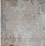 Vintage-style rug with a distressed appearance, featuring intricate floral motifs in muted beige, gray, and rust tones. Conveys an antique, textured look.