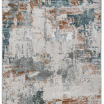Abstract area rug with a distressed, textured pattern in blue, gray, and rust tones. The design features scattered, brush-like overlaps.