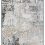Abstract rug with a textured, distressed pattern in gray, beige, and blue tones. The design has a weathered look, conveying a subtle, vintage feel.