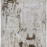 Abstract design rug in beige and brown tones, featuring a distressed texture. The pattern resembles brushstrokes, evoking an earthy, rustic feel.