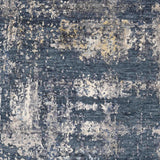 Luxury abstract rug with blue, white, and gold tones for elegant home decor