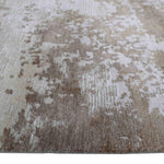 Luxury beige and white patterned rug with textured abstract design, ideal for elegant home decor.