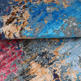 Luxury handcrafted rug with vibrant blue, red, and earthy tones for elegant home decor