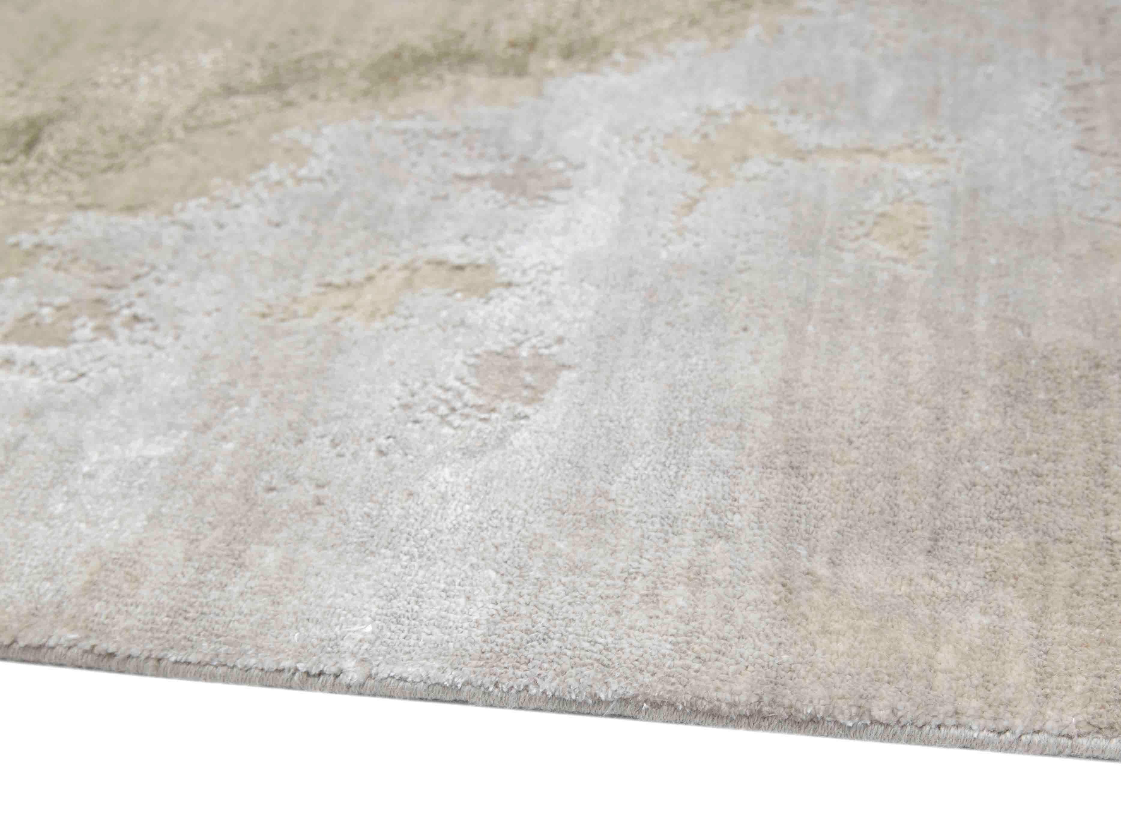 Soft beige luxury rug with subtle abstract patterns and plush texture for elegant home decor