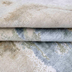 Luxury handcrafted rugs with intricate patterns and soft textures in neutral tones